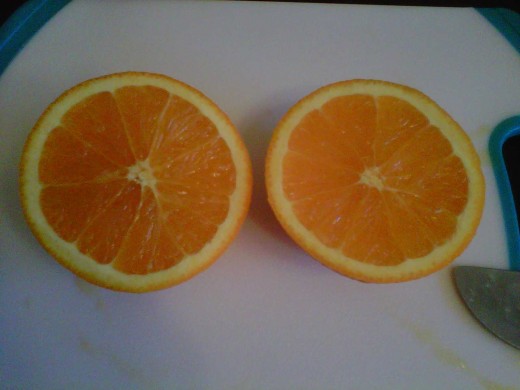Cut the grapefruit, oranges, lime, and lemon in half.