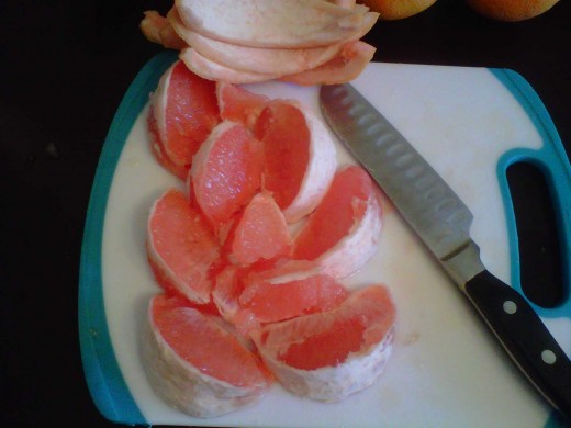 Remove the skin from the grapefruit and oranges. Remove any seeds as well.