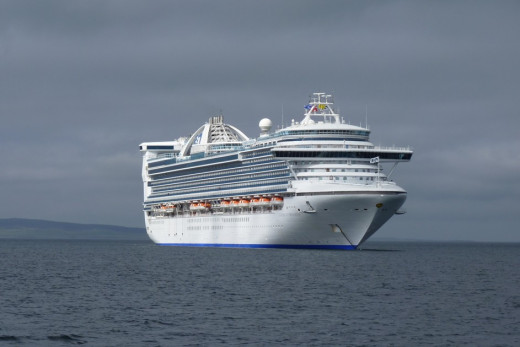 The 3,000+ passenger Caribbean Princess cruise ship in Kirkwall harbour in the Orkney Islands, Scotland UK in 2012.