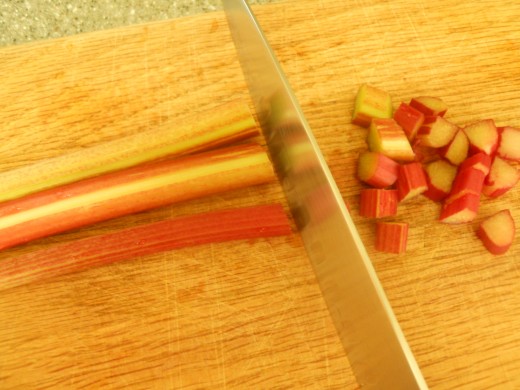 Chop rhubarb and large berries into bite sized pieces.