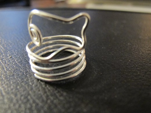 My fun, colorful wire wrapped coil ring designs -- perfect for kids! This is my swimming fish ring.