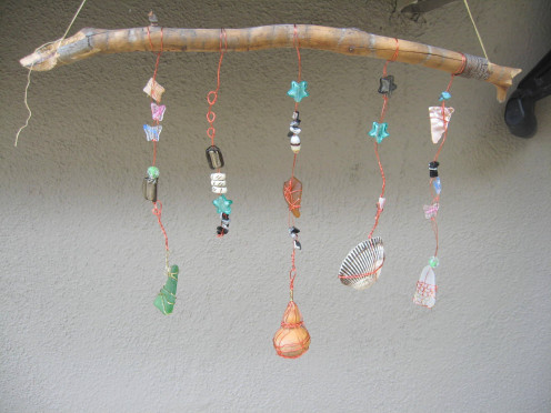 Make simple suncatchers with your collected stones, sea glass, and shells.