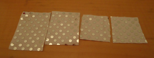 Cut squares of fabric