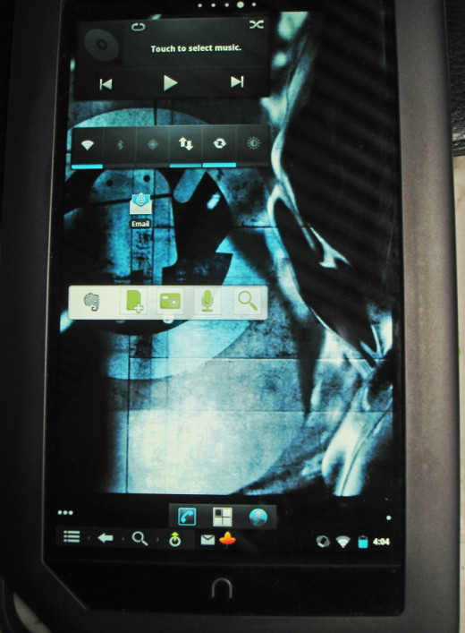 My Nook Color with Gingerbread - Cyanogen Mod 7 installed, plus a few widgets that I have put on.  I still have a lot more widget customization to do, but it is a functional tablet with bluetooth and has applications that I needed, like Evernote.