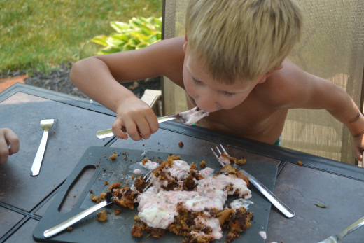 Son enjoying grilled cookie dough and thawing ice cream