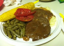 Hamburger Steak and Onion Gravy served tonight with Papa Bud's Corn on the Cob, green beans, and garlic mashed potatoes, not to mention sliced fresh tomatoes. YUMMY!