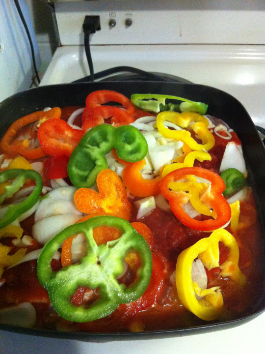Add peppers to the top, cover and cook until chicken is cooked.