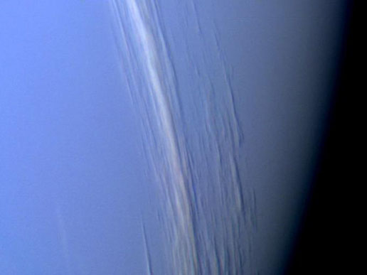 This close-up of the clouds of Neptune snapped by Voyager 2 in 1989 clearly shows how they howl around the planet at supersonic speeds.