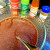 Add the chili powder, hot sauce, garlic powder, and cinnamon to the mixture and stir well.