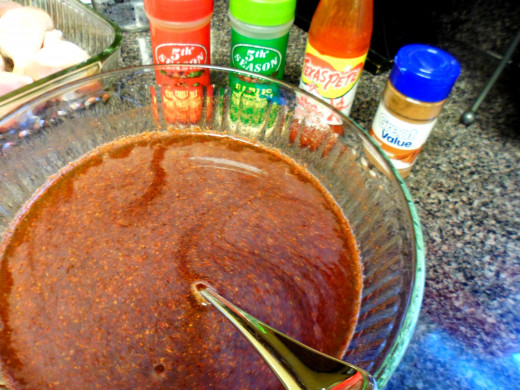 Add the chili powder, hot sauce, garlic powder, and cinnamon to the mixture and stir well.