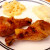 Coffee-brined chicken legs served with macaroni and cheese and mashed potatoes.
