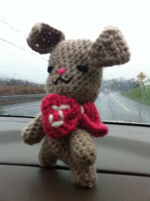 View of embroidered bow on crochet bunny.