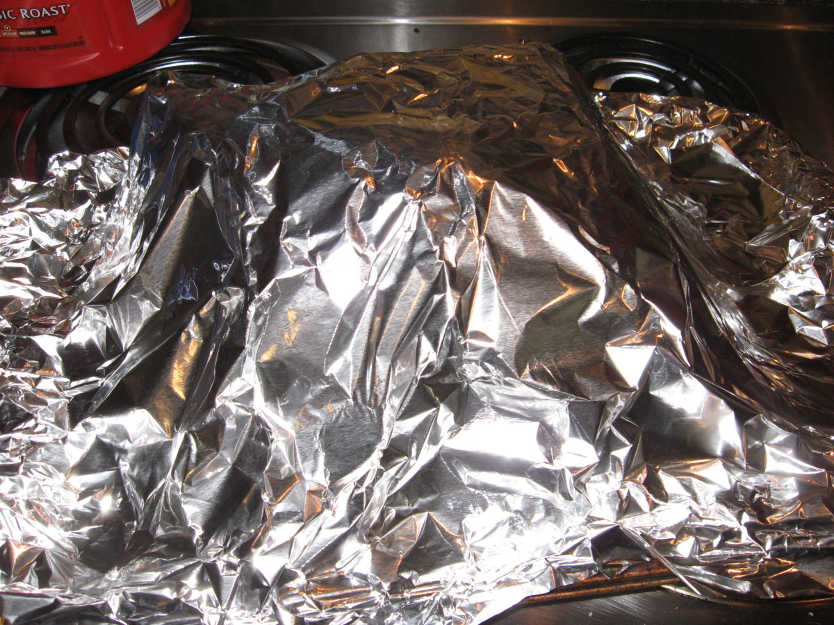 In the absence of a roaster, roast pork loin can be covered loosely with foil.