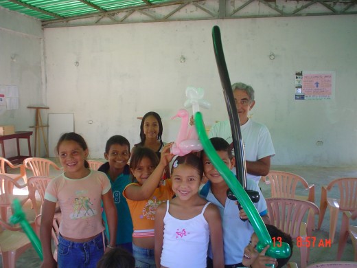 Don Langston making baloons for the kids at an orphanage.