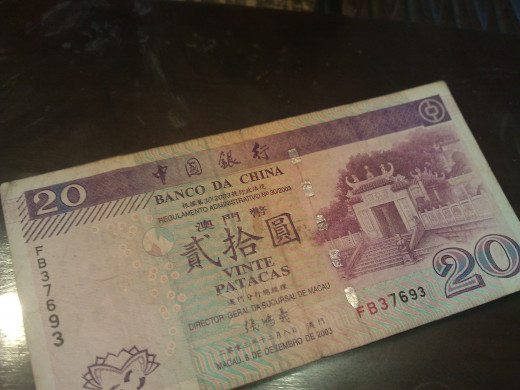 Macau Pataca- the official currency.  1USD = ~ 8 MOP 