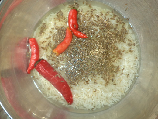 soaked rice, cumin seeds and red chillies