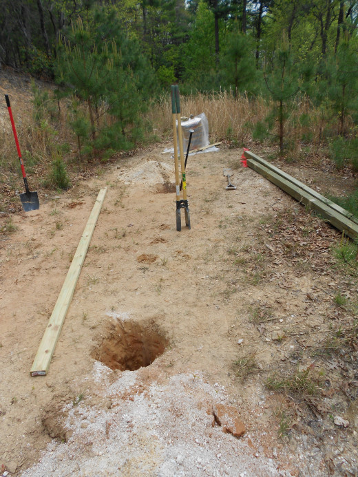 Equipment out and ready.  Two Holes being dug for the Vertical poles of the trellis