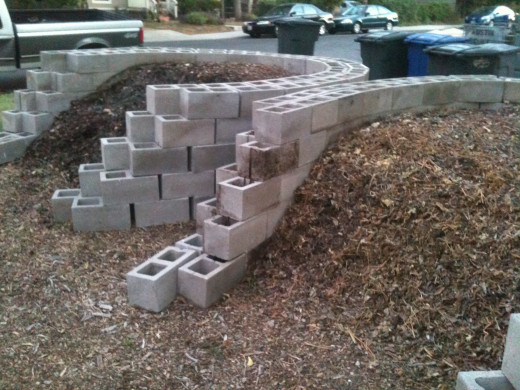 Compost bins can be made from concrete blocks (shown), wire fencing, even wood pallets.