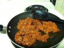 Brown chorizo in a skillet.