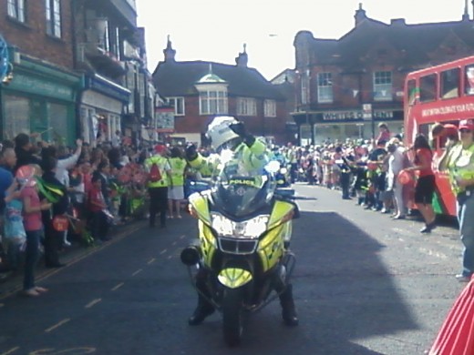 A dancing policeman at the torch relay in Sandwich