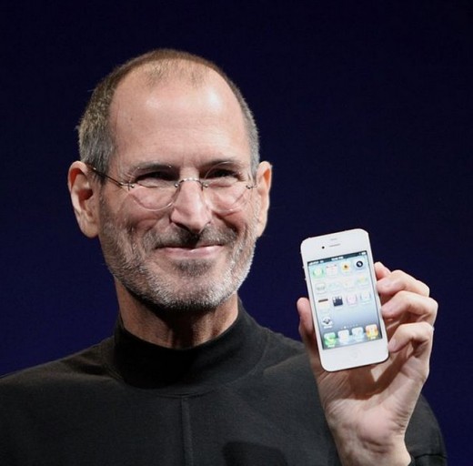 The late Steve Jobs showing the world one of his creations, the iPhone 4.