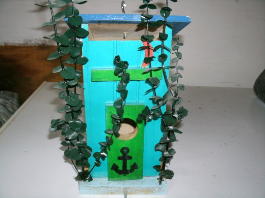 An outhouse birdhouse I made.