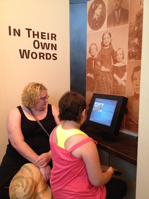 My sister and daughter doing an interactive display that provided 3 different points of view for several different events that have happened over time