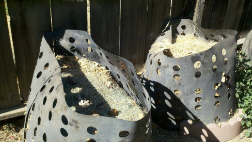 The two plastic compost bins we use for food scraps and yard waste
