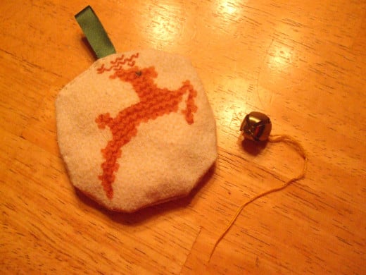 One side of a fabric Christmas ornament.