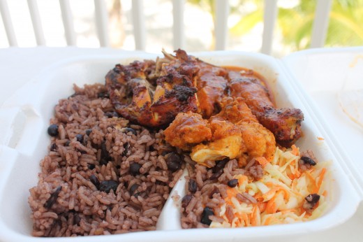 Jerk Chicken Leg Quarter, Beans and Rice, Coleslaw and a bit of Grilled Fish for $6US.  Absolutely delicious regardless of price.