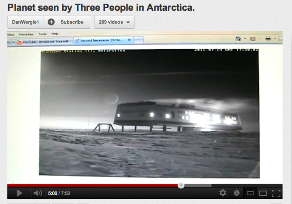A YT video screen capture shows a mystery planet in the Antarctica sky.