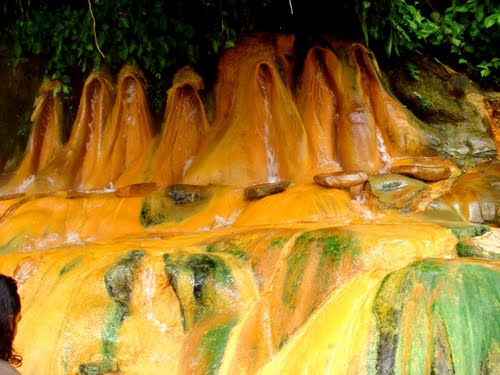 Pancuran Pitu (Seven Springs) in vivid color of sulfur deposits.