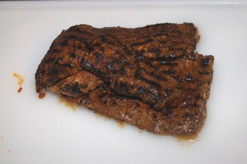 About a pound and a half of marinaded skirt steak, grilled rare over medium heat in a grill pan, then allowed to rest for a few minutes under foil.
