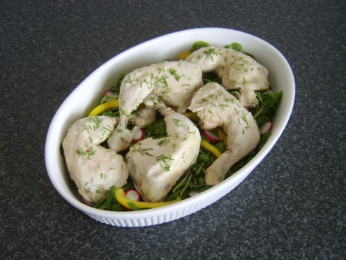 Whole chicken legs are poached and cooled before being served on a simple watercress salad bed
