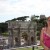 Standing inside the Colosseum with a view of the Arch of Constantine