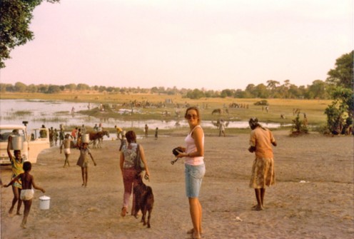 Gathering Water in Botswana (1975) - Women and girls carried heavy buckets filled with water on their heads.