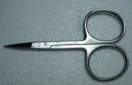 A typical fly tying scissors with wide handle loops