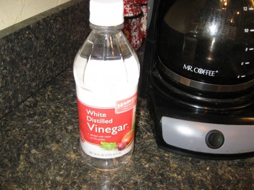 Use white vinegar and water to clean your coffee maker.