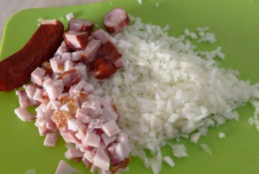 Chop the onion, bacon and kielbasa