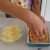Grace adds the vegetables, meat, and cheese. Grace adds the vegetables, meat, and cheese.