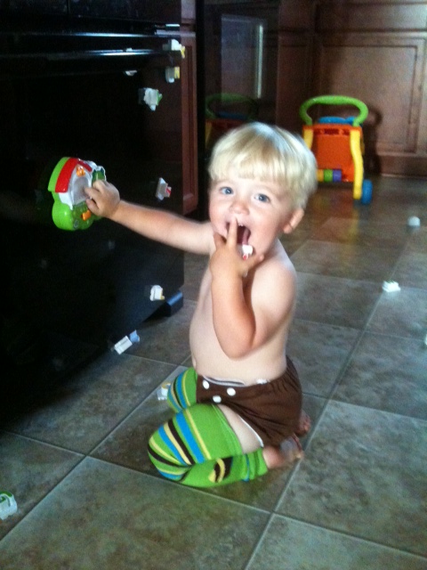My oldest playing in one of his cloth diapers.