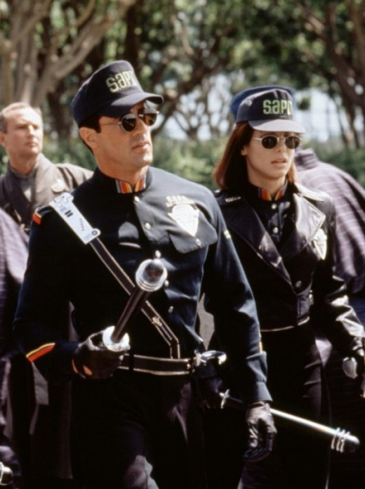 Sylvester Stallone and Sandra Bullock in Demolition Man (1993)