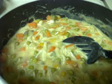Add cream soups, mixed vegetables, English peas, salt, and pepper to the chicken broth.  Finally, add shredded chicken.