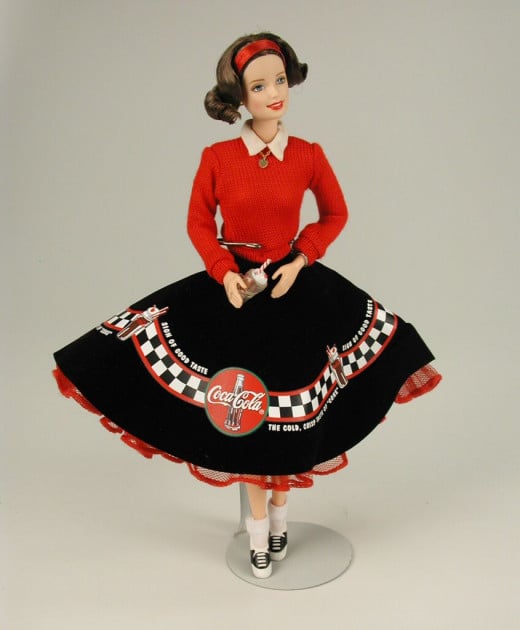 Coca Cola Barbie Doll in black and red skirt reminiscent of pool skirts