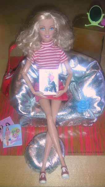 Barbie showing off her magazine