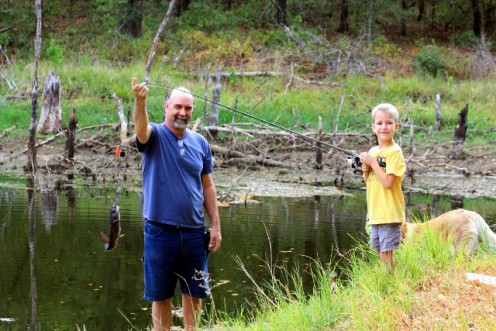 "Papa" Johnny showing off Ethan's catch of the day.