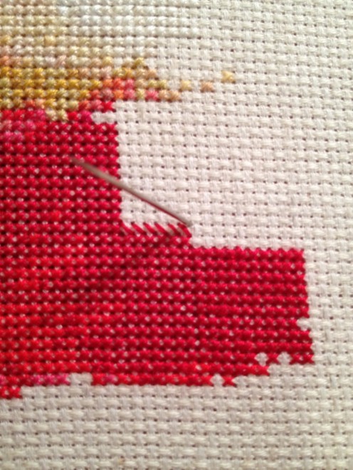 This shows the first half of 6 red stitches, starting in the upper left corner going down through the lower right corner of each X This shows the first half of 6 red stitches, starting in the upper left corner going down through the lower right corner of each X