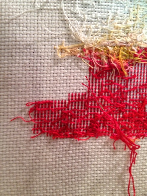 This shows the backside of the project with the loose tails run under existing stitches. This shows the backside of the project with the loose tails run under existing stitches.