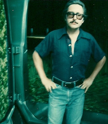 Me in 1979 after I had customized my new van with a table, refrigerator, bench seating and shag carpeting. Oh...and the ceiling mounted 8 track tape system. 