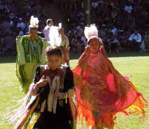 After the dance, young women dancers leave the field.